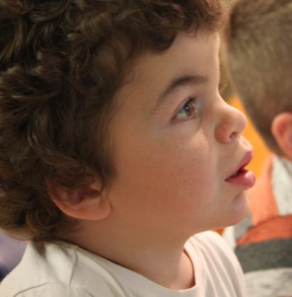 Pudding watching TV in the hospital playroom