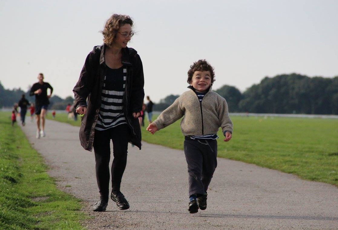 Pudding and me running along track through green space