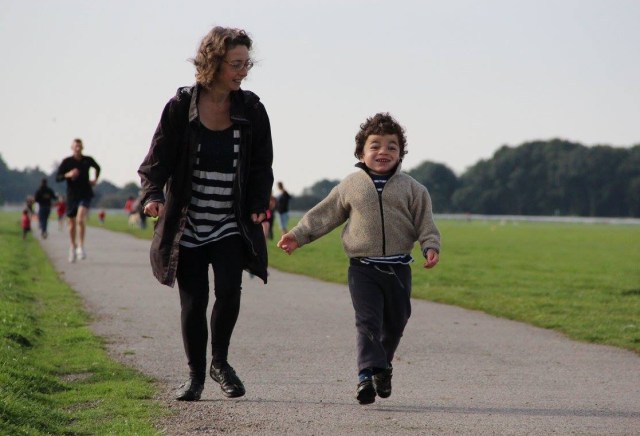 Pudding and me running along track through green space