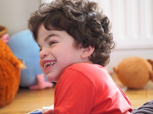 Pudding with an enormous smile, watching TV